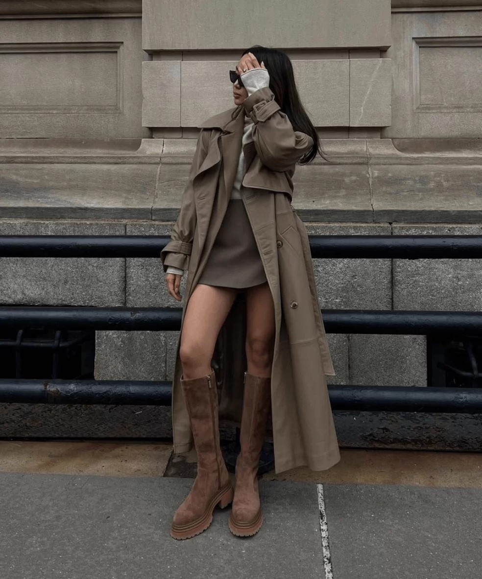 combinar saia de couro marrom com bota cano alto