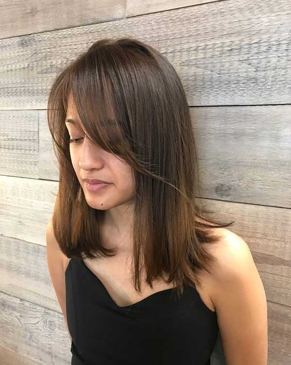 corte de cabelo longo com franjão