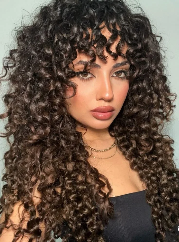 quanto custa um corte de cabelo cacheado longo profissional