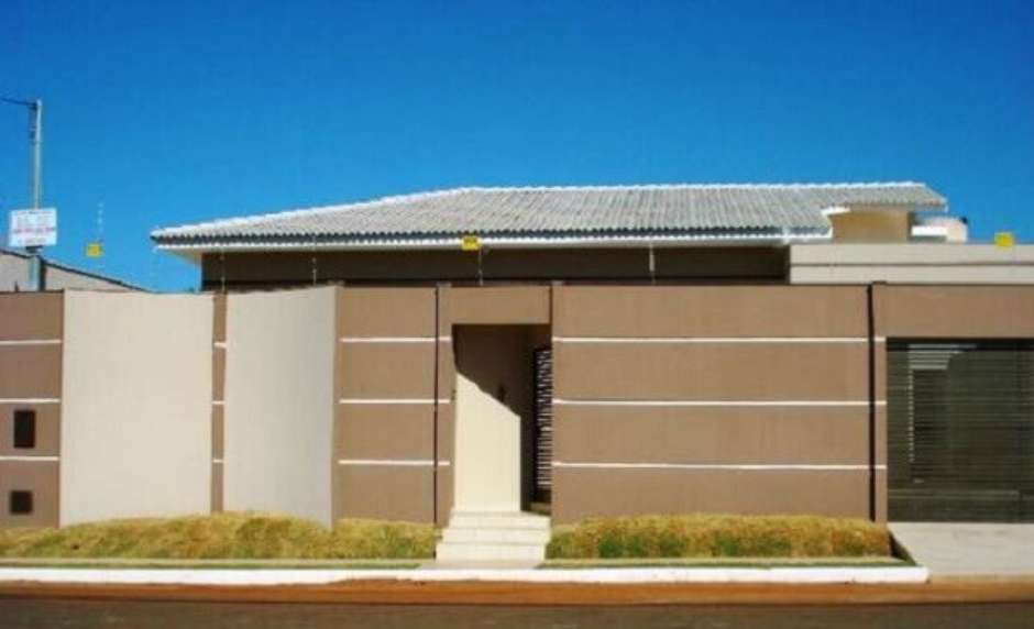 muro de casa com concertina