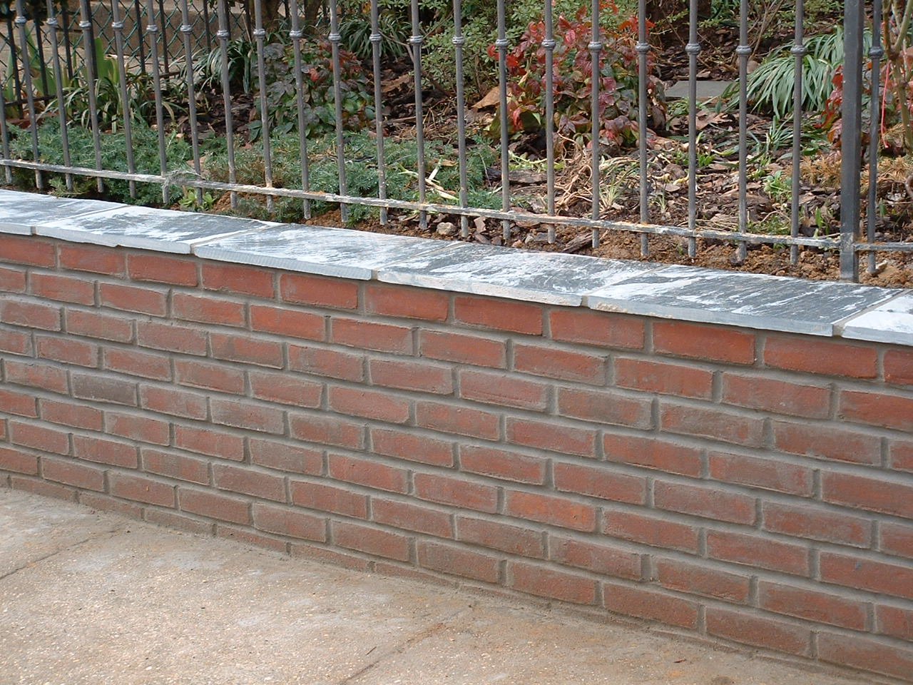 como fazer muro de tijolos