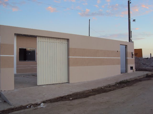 muro simples com portão de tijolo