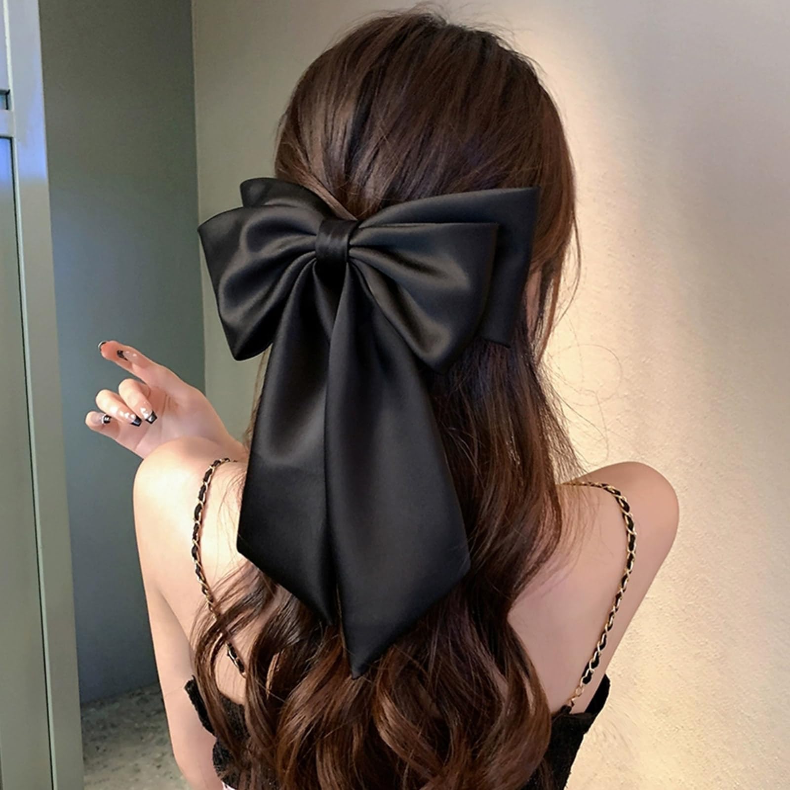 penteado com laço grande semi-preso