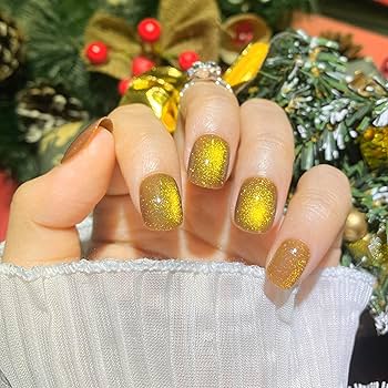 unha em gel amarela com glitter dourado