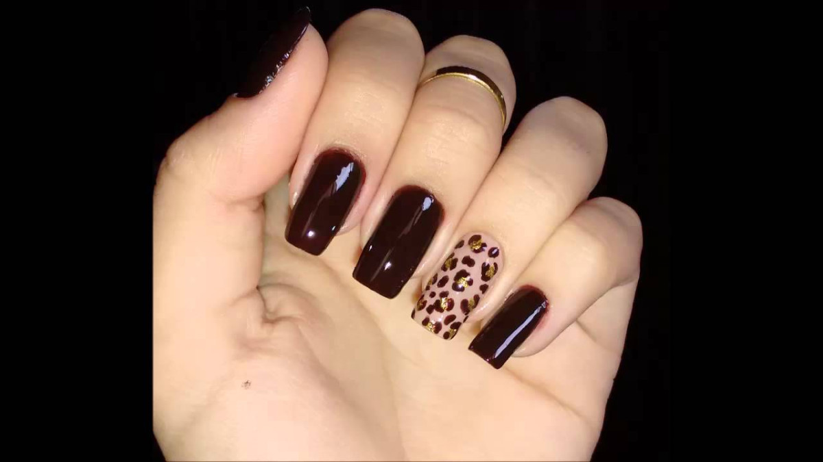 unhas decoradas com estampa de oncinha